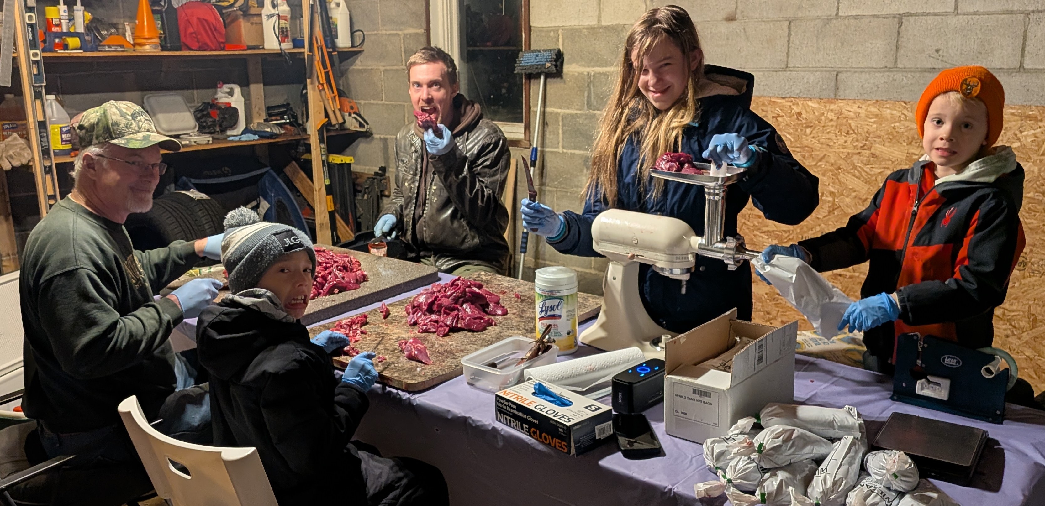 Family processing deer
